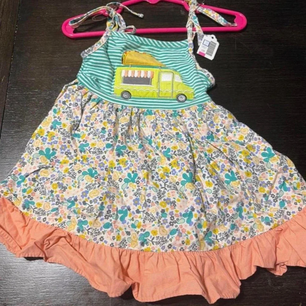 RicRac & ruffles 2T taco truck dress. Never worn, tags just taken off'